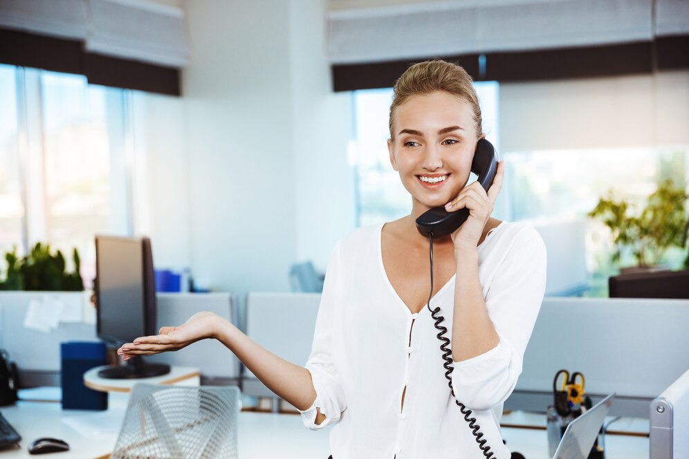 young-beautiful-successful-businesswoman-smiling-speaking-phone-office_176420-966 VoIP services for businesses Fresno